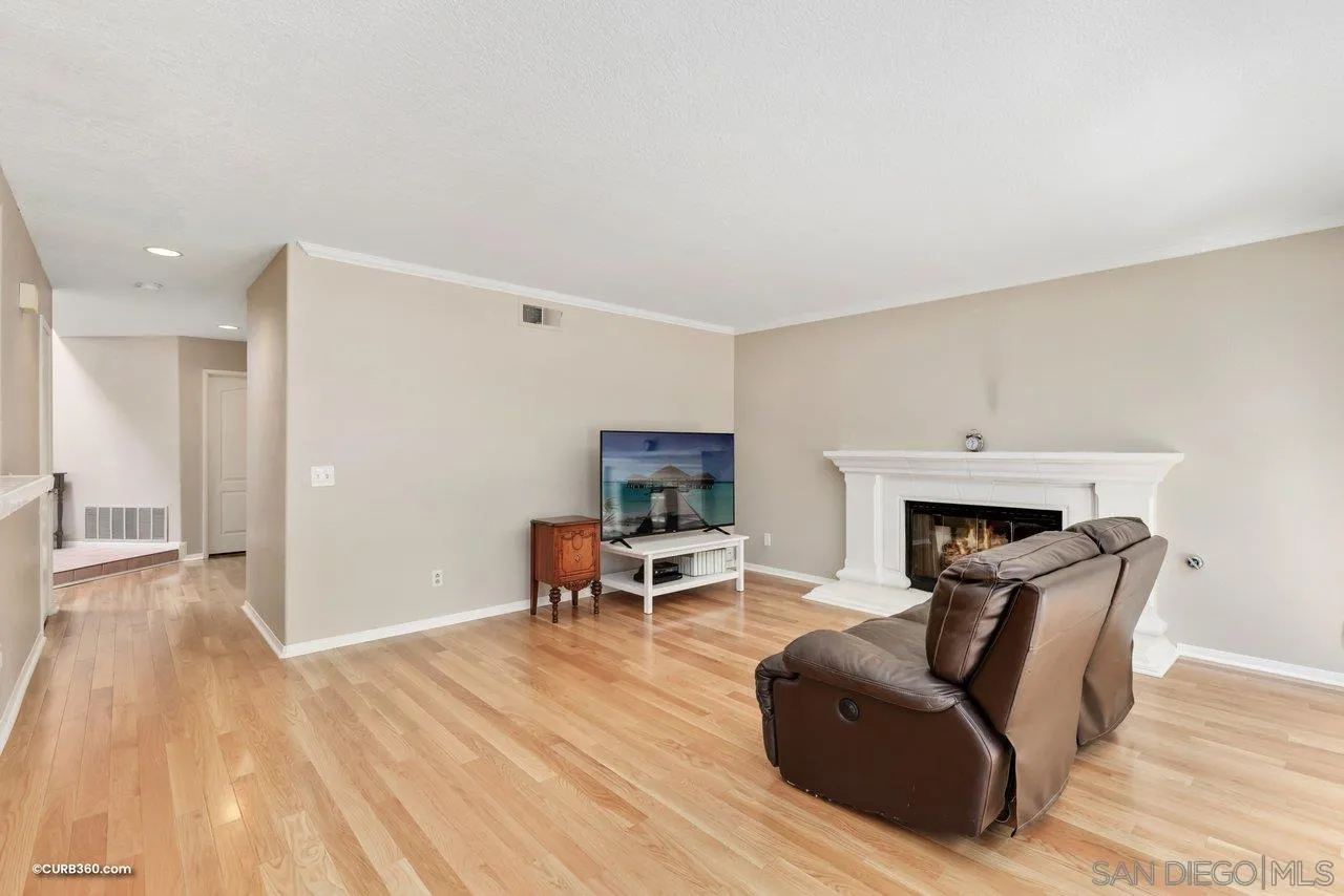 5138 Vía Madrid Oceanside, CA 92057 - Photo 16 of 32 a living room with furniture and a wooden floor