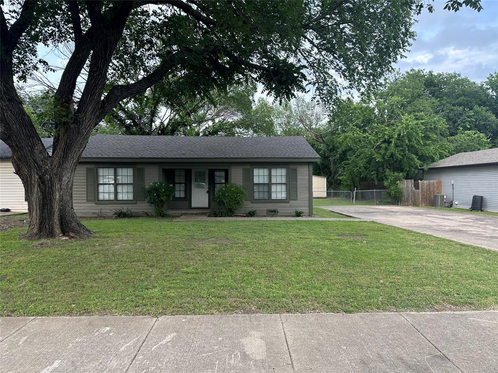 129 Del Rio Avenue Benbrook, TX 76126 - Photo 1 of 1 a front view of a house with a garden
