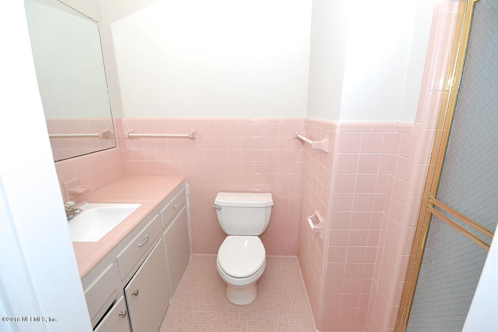 6638 West Fincannon Road Jacksonville, FL 32277 - Photo 15 of 27 a bathroom with a toilet and a sink