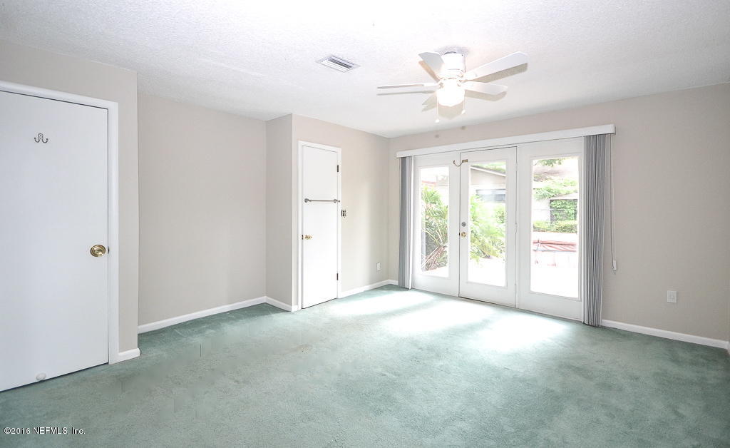 6638 West Fincannon Road Jacksonville, FL 32277 - Photo 16 of 27 a view of a livingroom with a ceiling fan and window