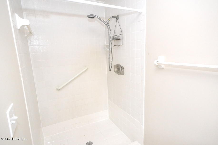 6638 West Fincannon Road Jacksonville, FL 32277 - Photo 18 of 27 a bathroom with a shower