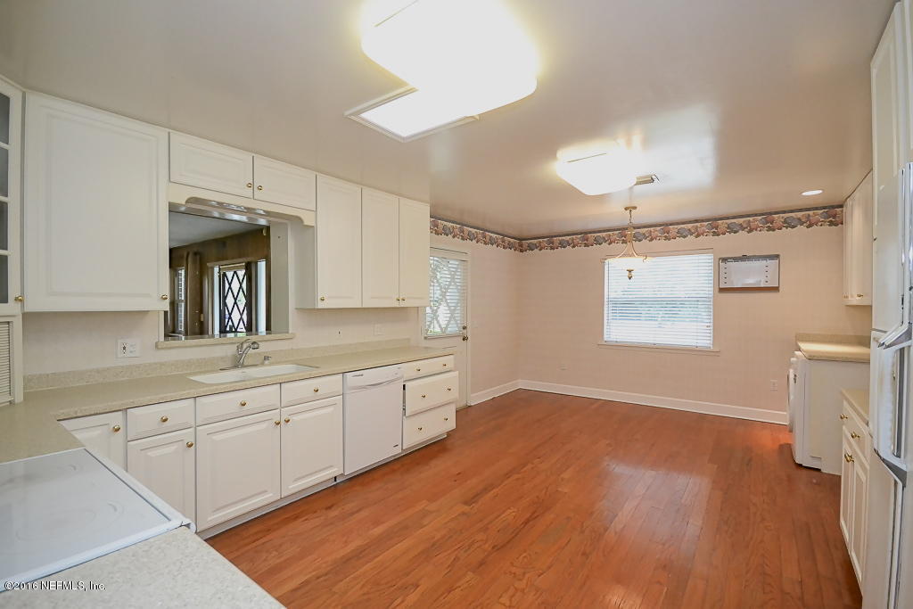 6638 West Fincannon Road Jacksonville, FL 32277 - Photo 7 of 27 a spacious bathroom with a granite countertop sink a mirror and a shower