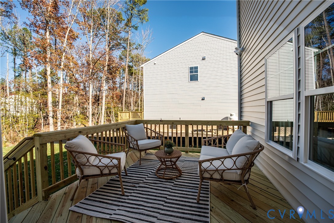 5318 Qualla Trace Chesterfield, VA 23832 - Photo 14 of 35 a view of a chairs and table on the deck