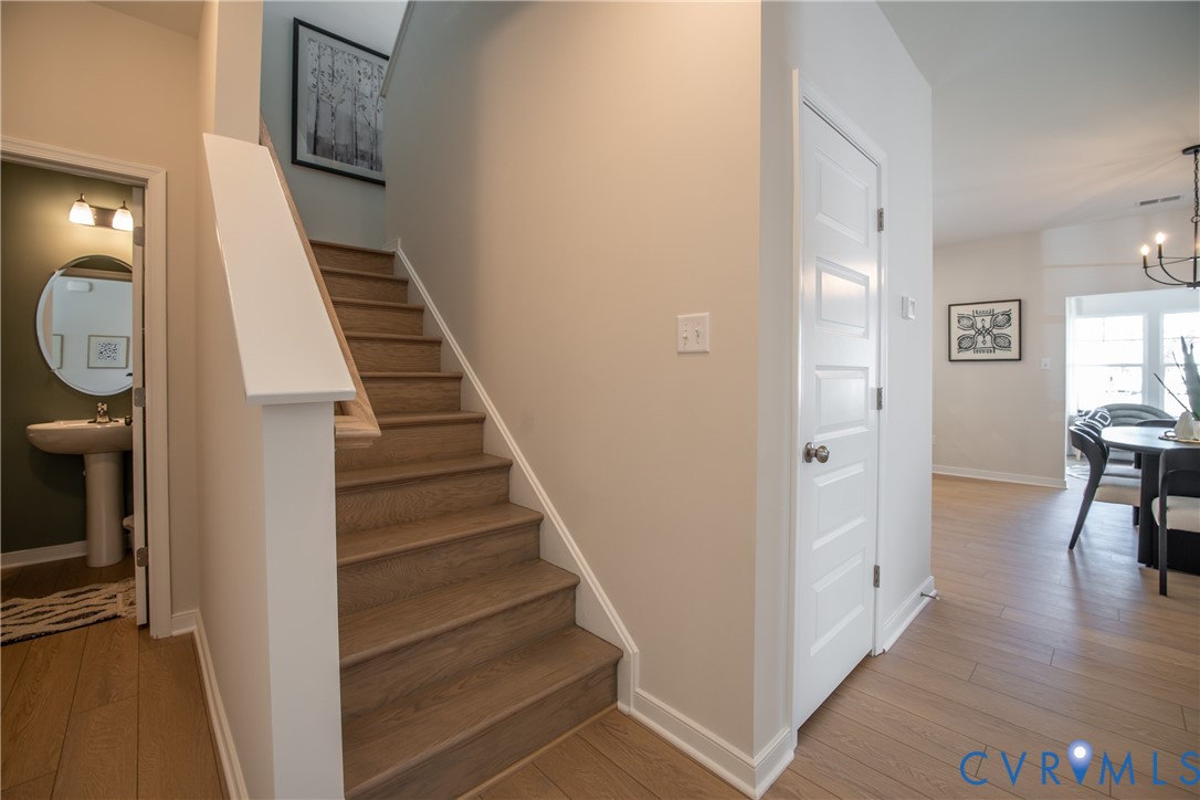 5318 Qualla Trace Chesterfield, VA 23832 - Photo 16 of 35 a view of a livingroom with wooden floor and stairs
