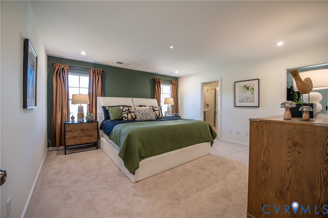5318 Qualla Trace Chesterfield, VA 23832 - Photo 21 of 35 a bedroom with a bed and a large mirror