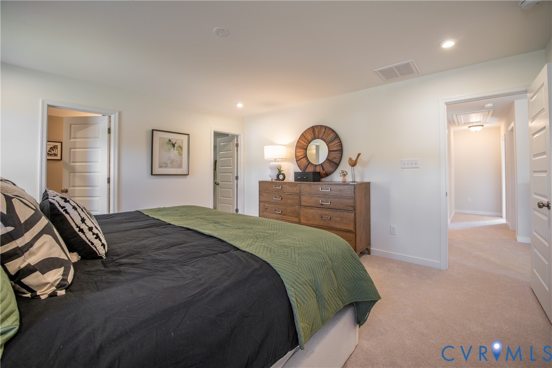 5318 Qualla Trace Chesterfield, VA 23832 - Photo 22 of 35 a bedroom with a bed and a dresser
