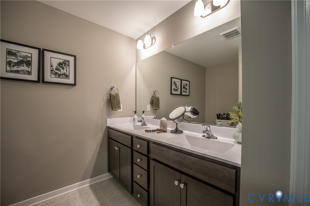 5318 Qualla Trace Chesterfield, VA 23832 - Photo 27 of 35 a bathroom with a sink and a mirror