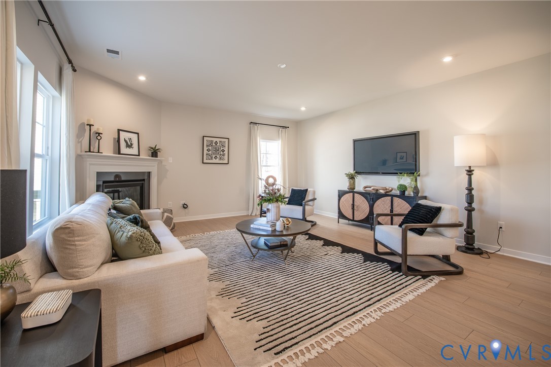 5318 Qualla Trace Chesterfield, VA 23832 - Photo 4 of 35 a living room with furniture and a fireplace