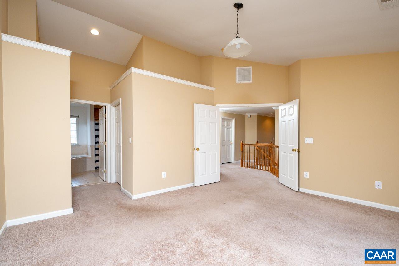 5378 Park Road Crozet, VA 22932 - Photo 24 of 40 a view of a room with a hallway and a chandelier