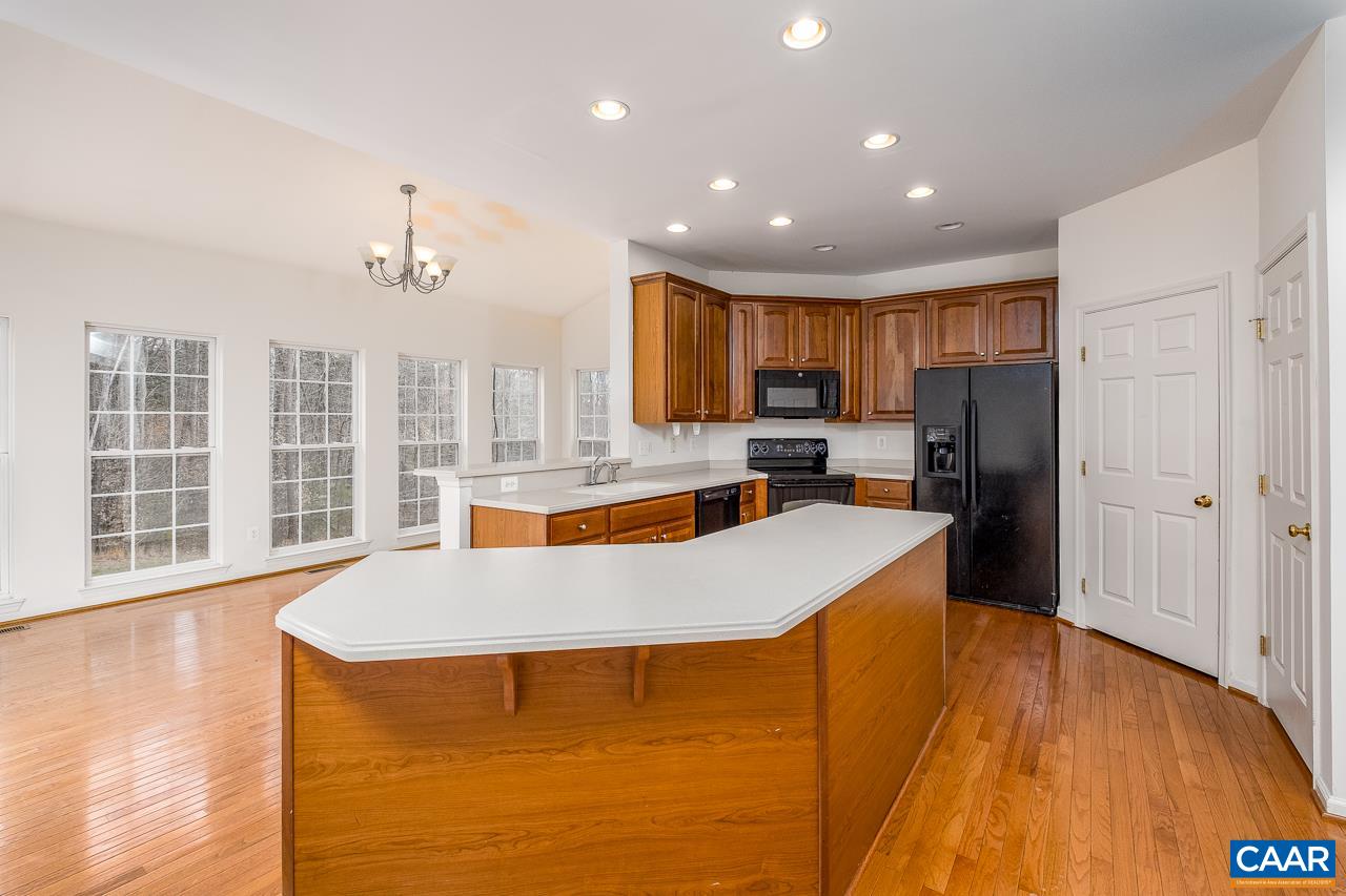 5378 Park Road Crozet, VA 22932 - Photo 3 of 40 a large kitchen with stainless steel appliances a large counter top a stove and a refrigerator