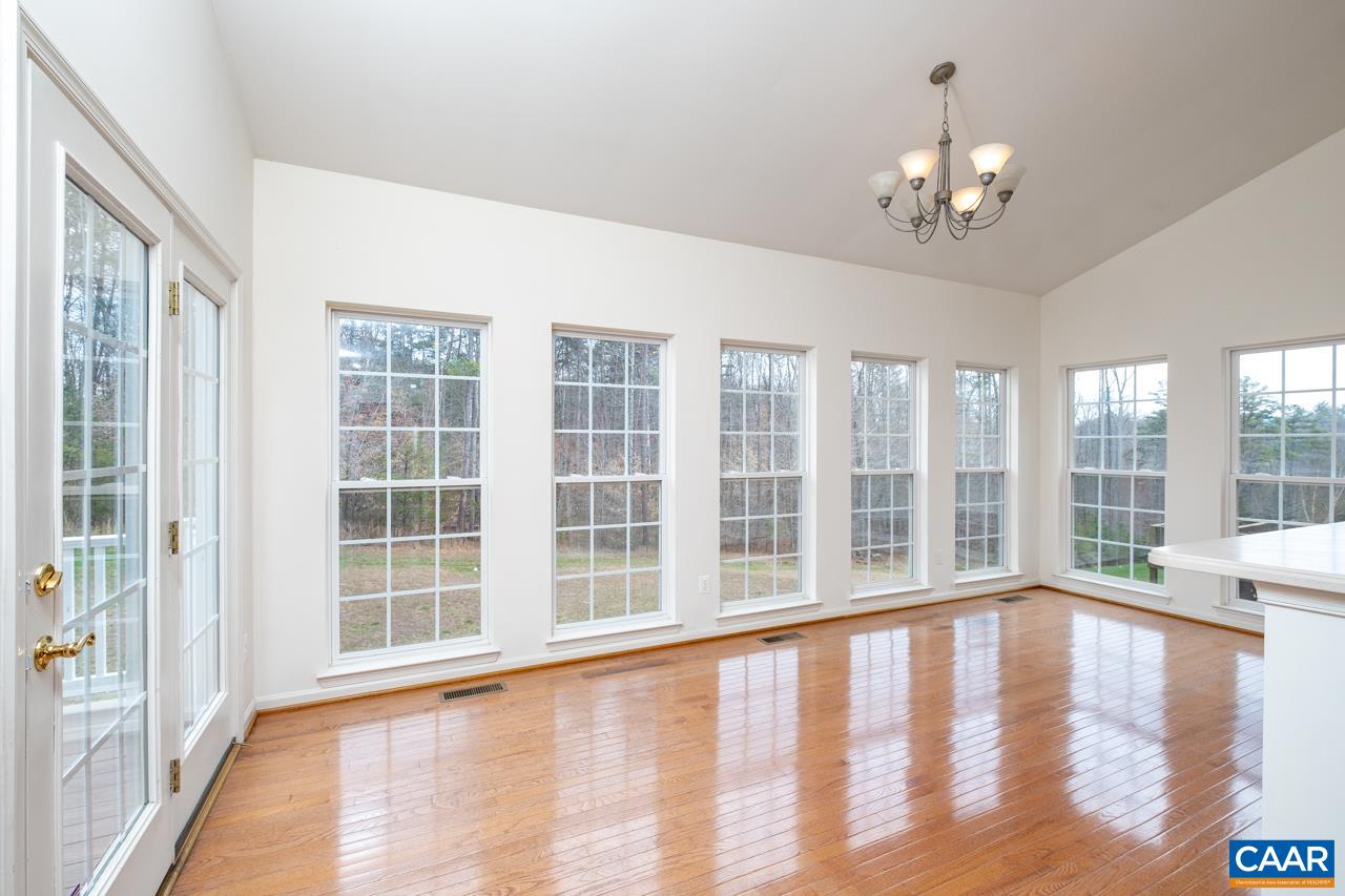 5378 Park Road Crozet, VA 22932 - Photo 5 of 40 a view of an empty room with wooden floor and a window