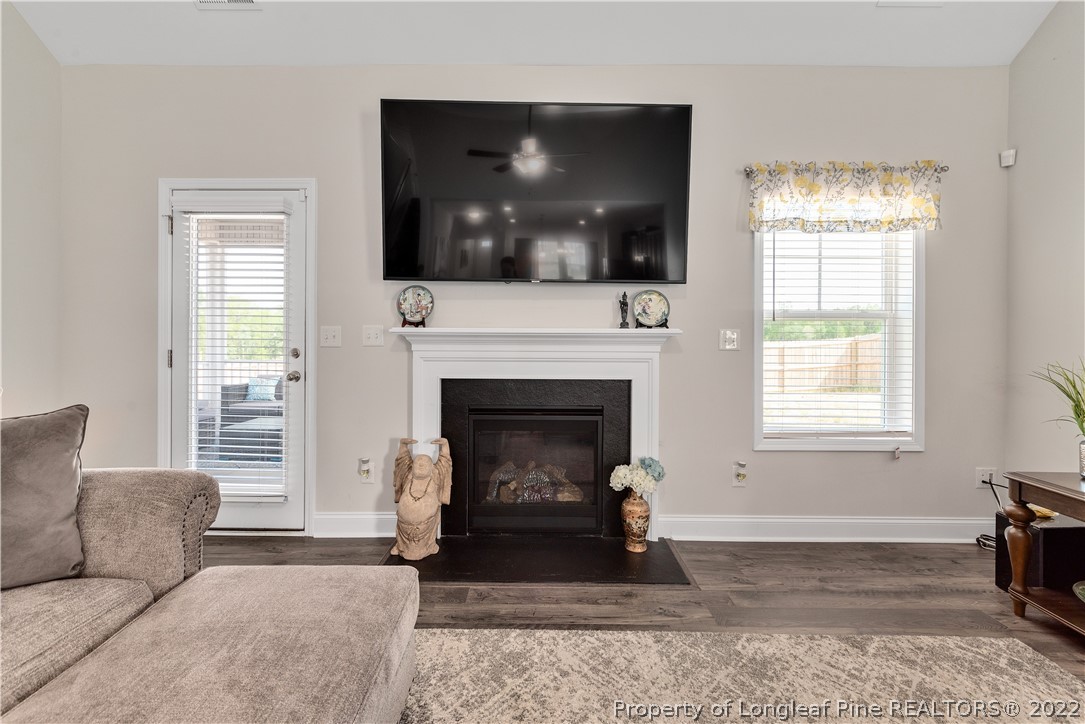 162 Trinity Road Raeford, NC 28376 - Photo 15 of 33 a living room with furniture and a fireplace
