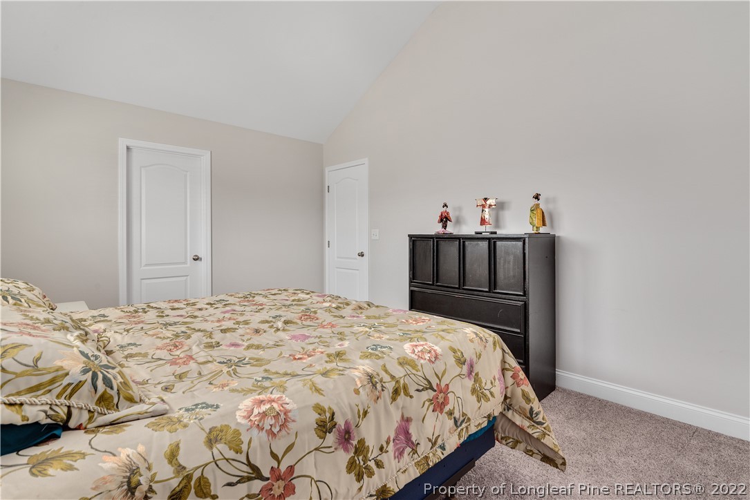 162 Trinity Road Raeford, NC 28376 - Photo 24 of 33 a bedroom with a bed and cabinet