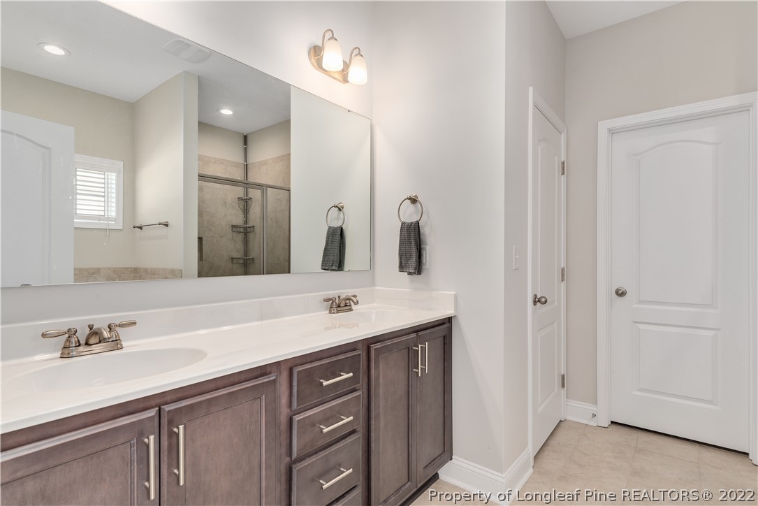 162 Trinity Road Raeford, NC 28376 - Photo 26 of 33 a bathroom with a sink and a mirror