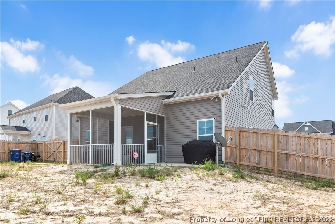 162 Trinity Road Raeford, NC 28376 - Photo 31 of 33 a view of a house with a yard and garage
