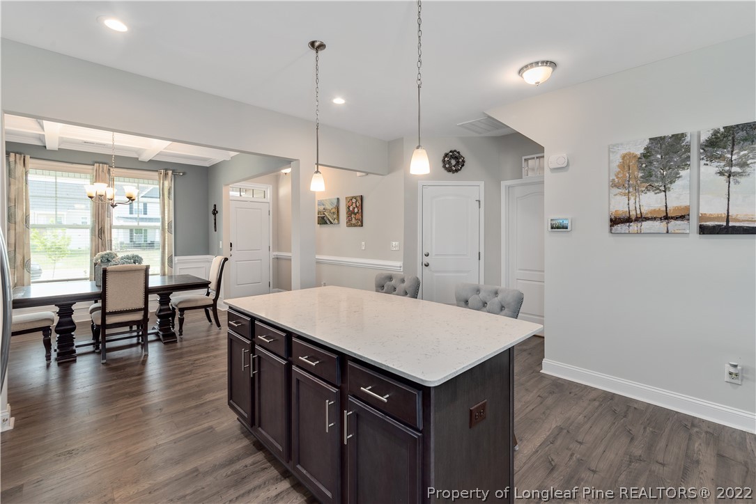 162 Trinity Road Raeford, NC 28376 - Photo 7 of 33 an open kitchen with a table and chairs