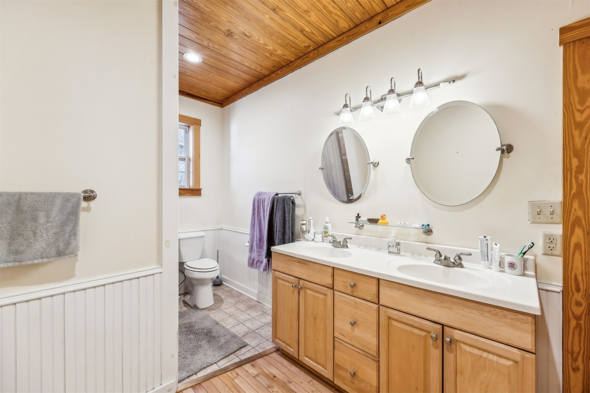 86205 Pages Dairy Road Yulee, FL 32097 - Photo 31 of 56 a bathroom with a double vanity sink and a mirror