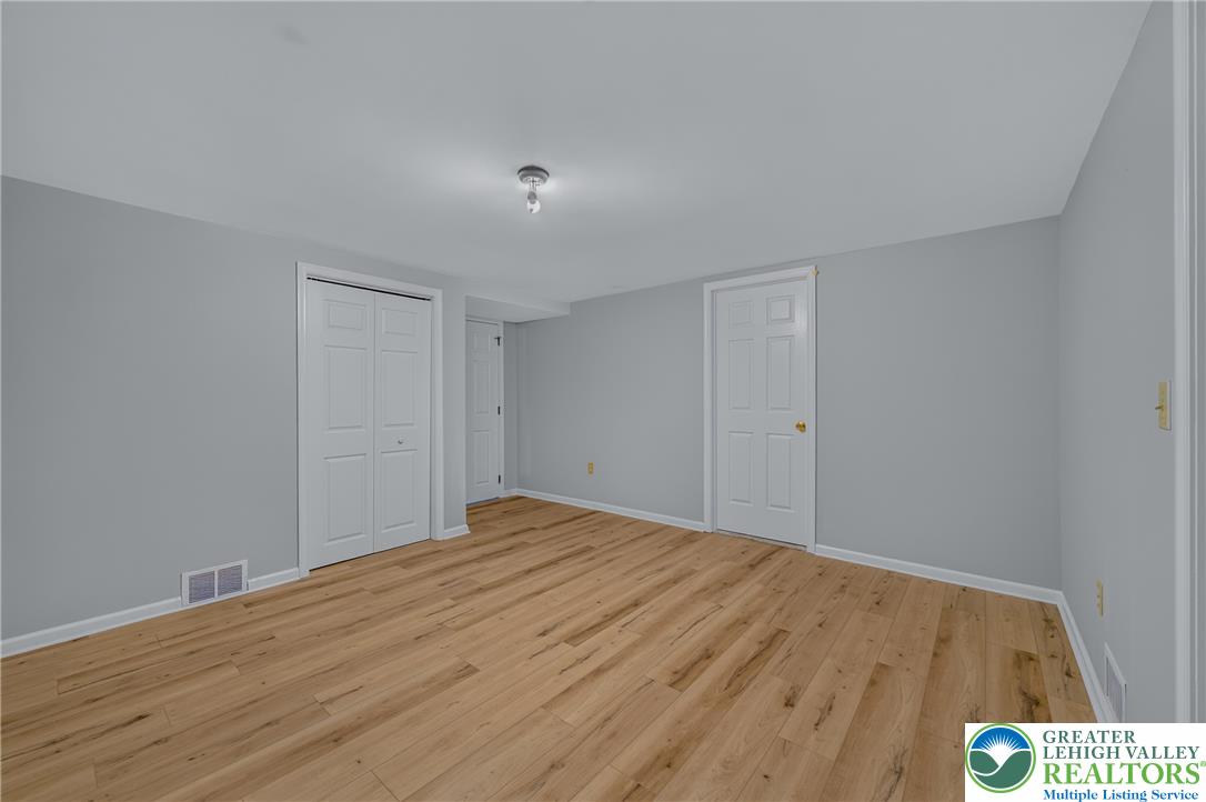 630 Clearfield Road Nazareth, PA 18064 - Photo 78 of 100 Gleaming wood floors anchor this versatile room illuminated by central lighting.
