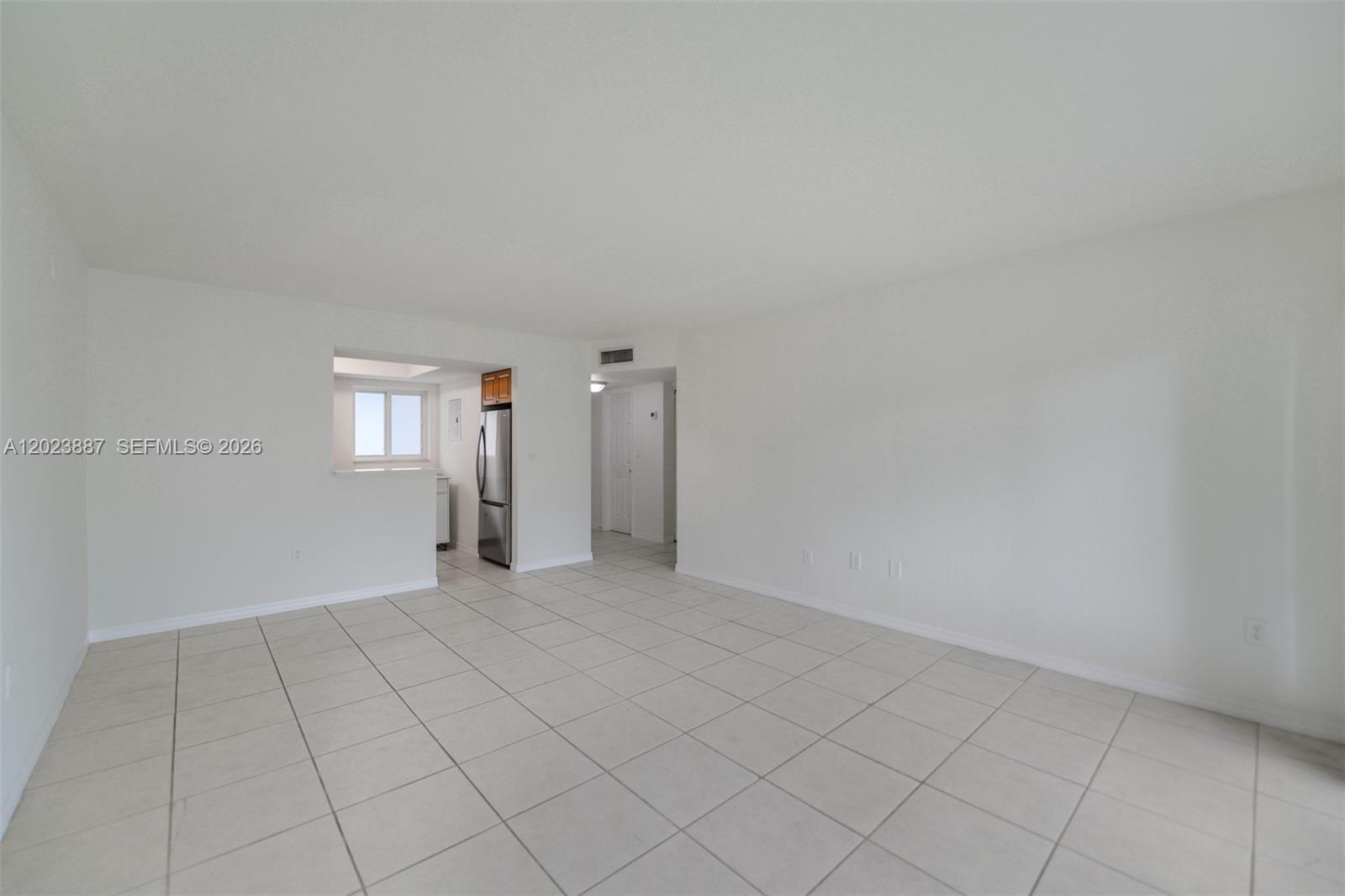7737 Southwest 88th Street, Unit C312 Miami, FL 33156 - Photo 5 of 32 an empty room with windows
