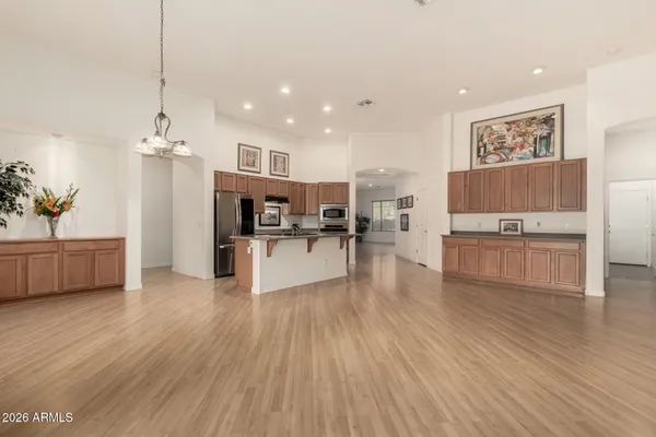 a living room with furniture and kitchen view