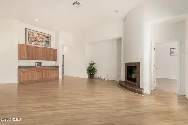 a view of a kitchen with furniture and a fireplace