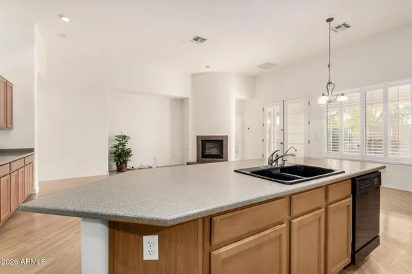 a kitchen with a sink and stove