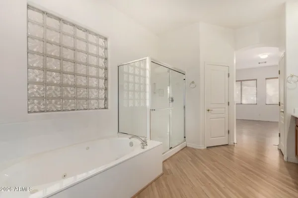 a bathroom with a bathtub and a shower