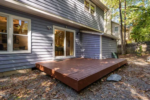 a view of a wooden floor with a wooden fence