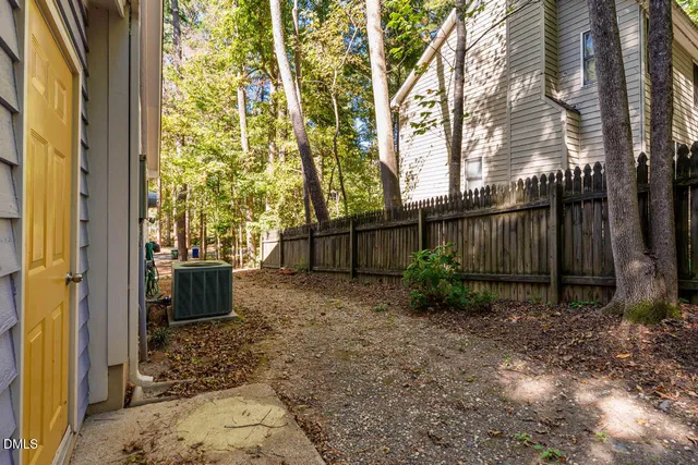a view of a yard with trees