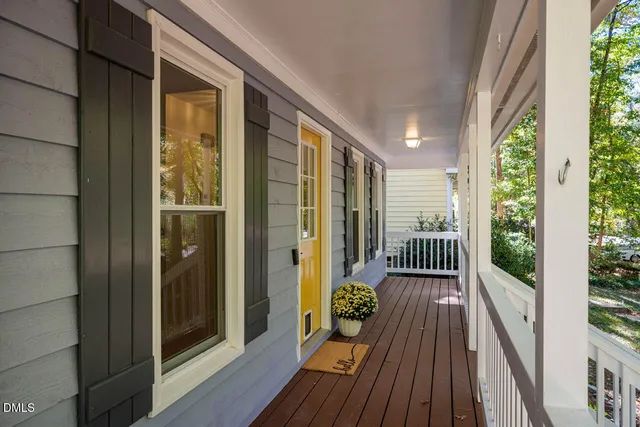 a view of balcony with wooden floor