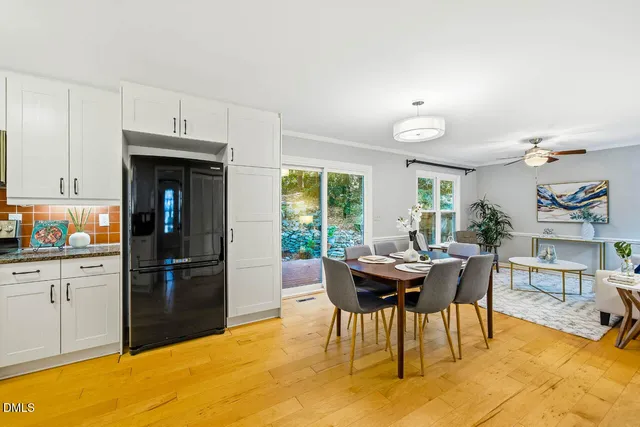 a dining room with furniture and window