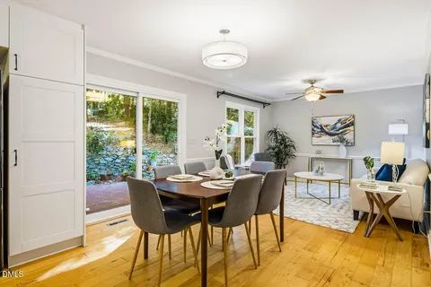 a dining room with furniture and window
