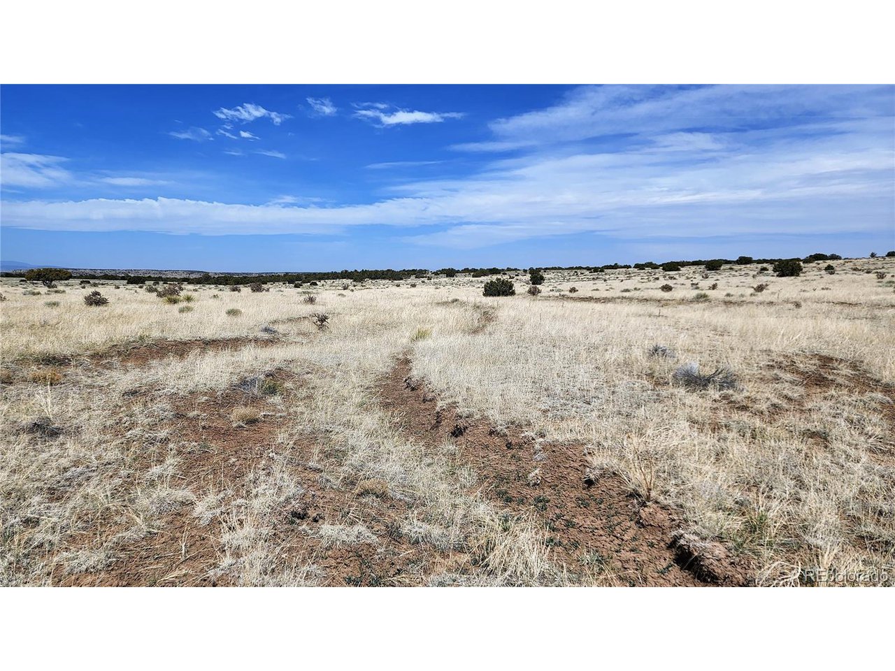 72 Turkey Ridge Ranch Walsenburg, CO 81089 - Photo 13 of 40 a open area with a bench and a wooden fence