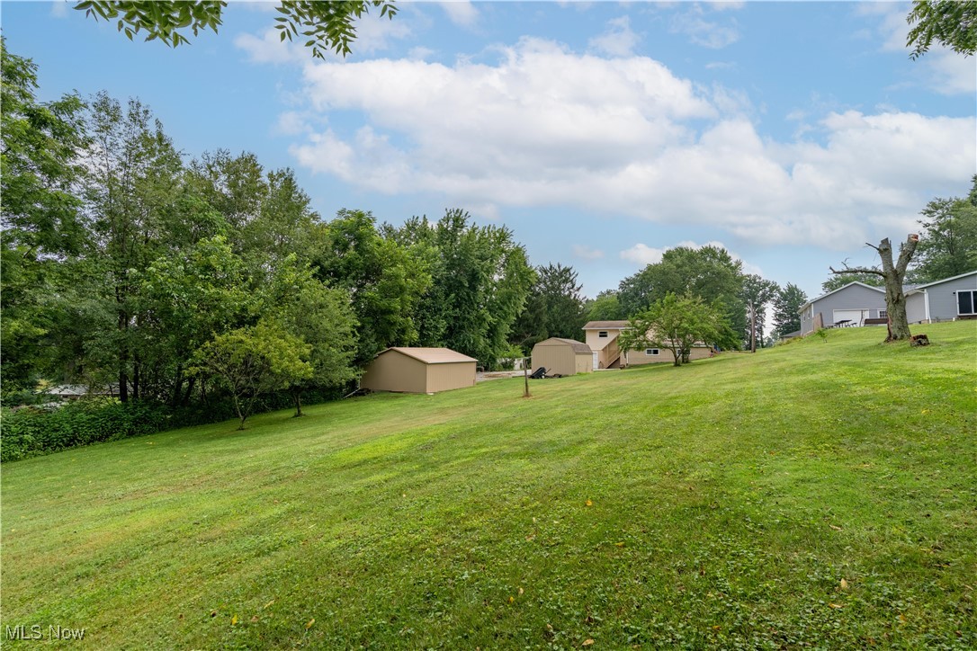 1766 Far View Road Akron, OH 44312 - Photo 32 of 33 View of grassy yard featuring a storage unit