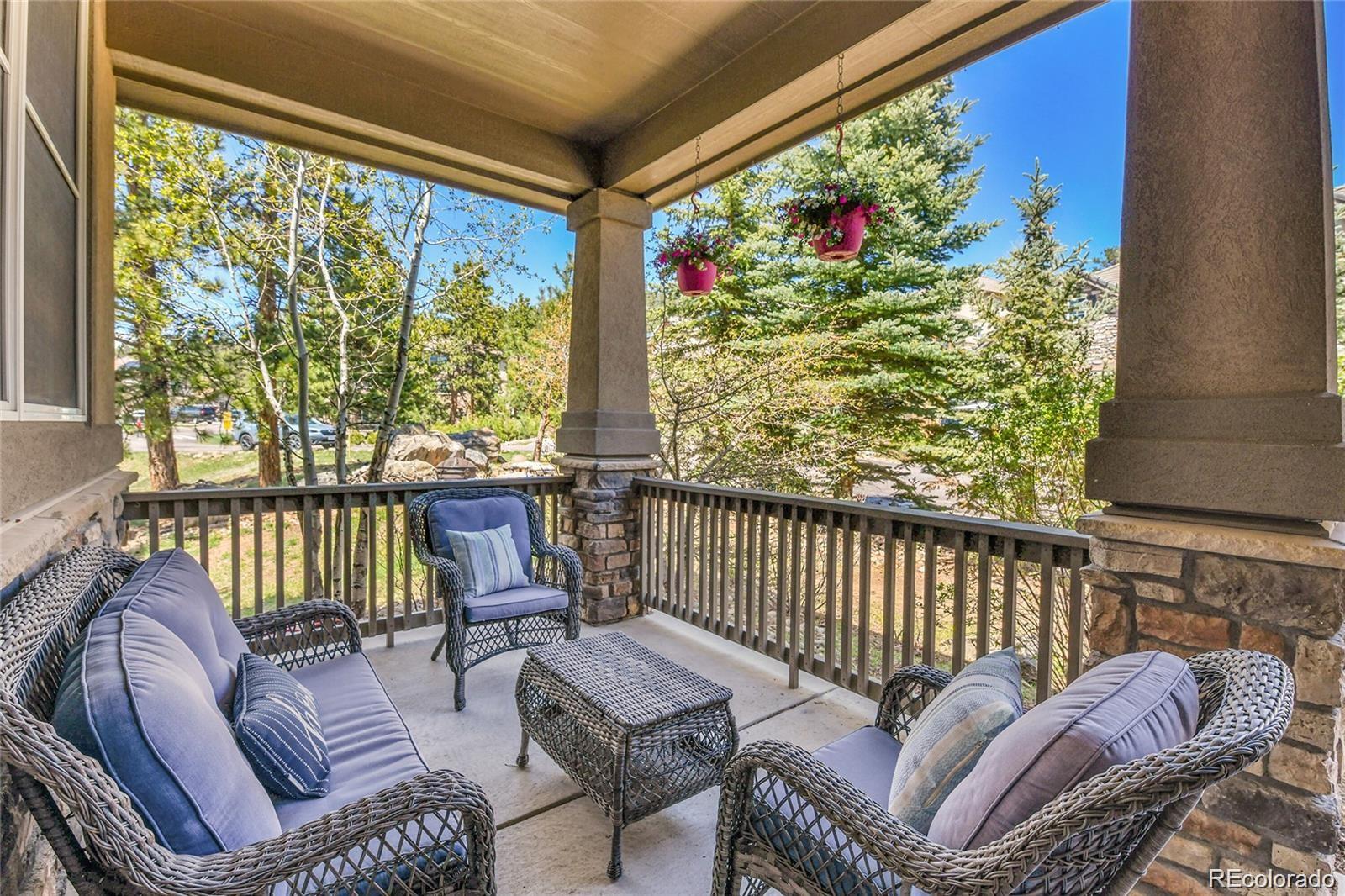 791 Elk Rest Road Evergreen, CO 80439 - Photo 3 of 46 a balcony with furniture and a potted plant