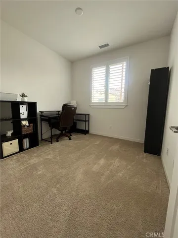 a livingroom with furniture and a window