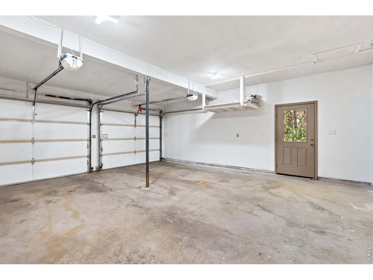 2121 18th Street Road Greeley, CO 80631 - Photo 38 of 40 Oversized finished garage with double door entry and access to the side yard.