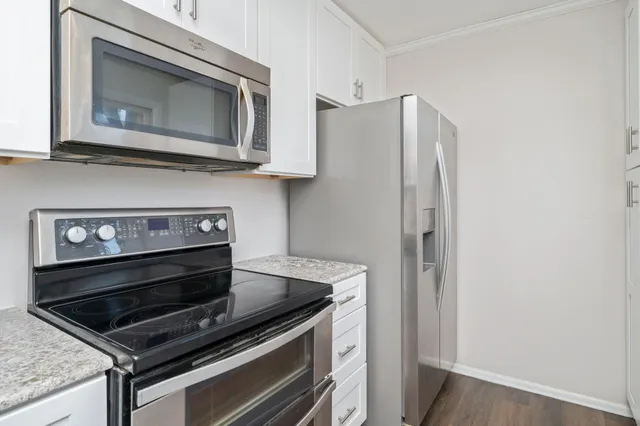 a kitchen with a stove and a microwave