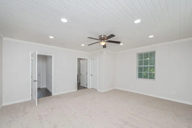 a bathroom with a granite countertop sink a mirror and a bathtub