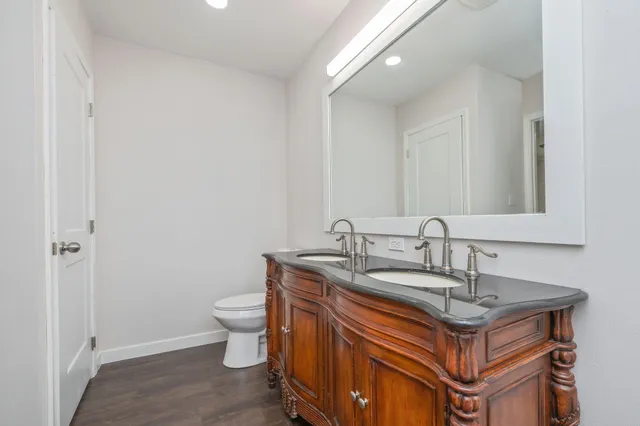 a dining table with a sink and a mirror