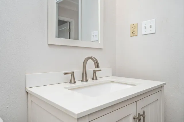 a bathroom with a bath tub with a shower
