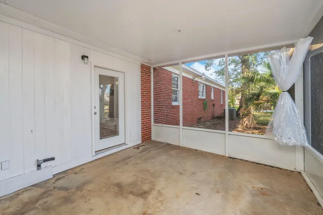 a view of a yard with a tree