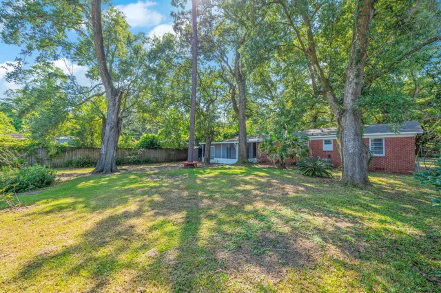 a view of yard with swimming pool