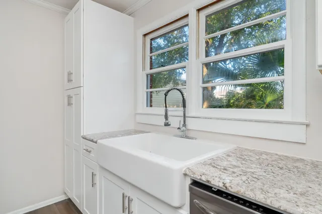 a kitchen with a sink and a window
