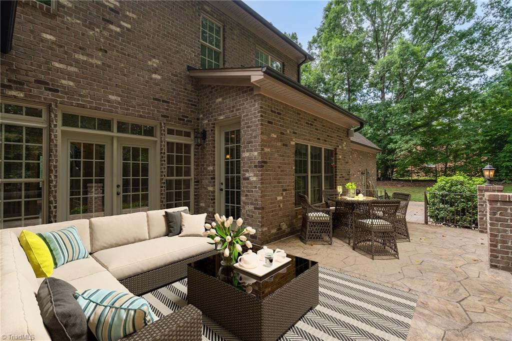 8410 Linville Oaks Drive Oak Ridge, NC 27310 - Photo 42 of 47 Back Patio- virtual staging