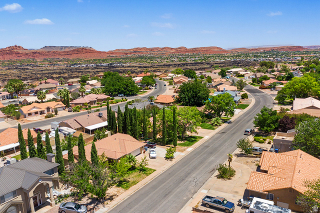 3034 Swiss Drive Santa Clara, UT 84765 - Photo 53 of 59 Residential neighborhood featuring a paved street, mature trees, and single-story homes with tile roofs