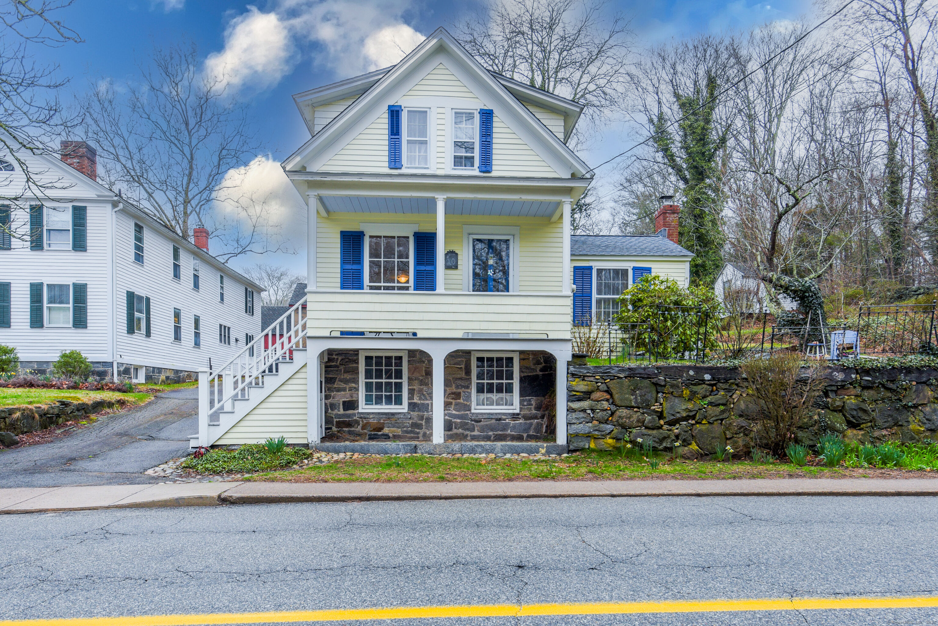 a front view of a house with a yard