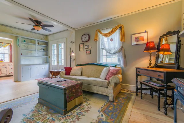 a view of room with furniture and wooden floor