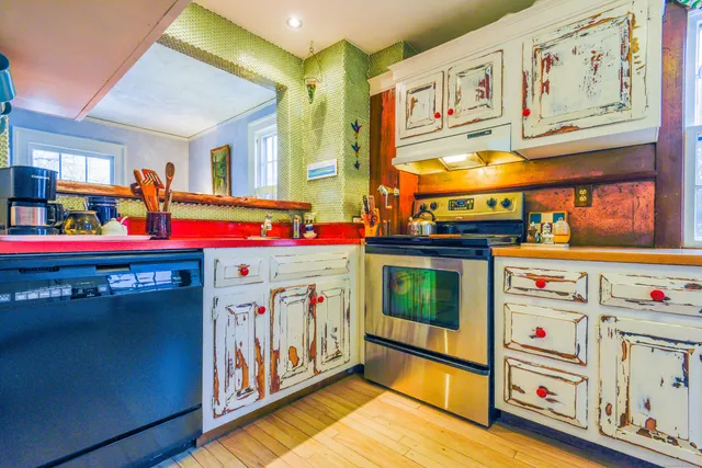 a kitchen with stainless steel appliances a stove and a refrigerator