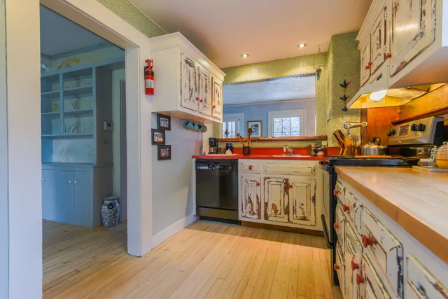 a kitchen with stainless steel appliances granite countertop a stove and a sink